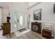 Inviting foyer featuring light wood floors, decorative accents, and a bright, airy feel from the front door's sidelights at 10241 Pointview Ct, Orlando, FL 32836