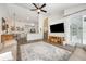 Spacious living room with an open floor plan, modern decor, and sliding glass doors leading to the pool area at 10241 Pointview Ct, Orlando, FL 32836