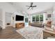 Bright living room with modern furnishings, hardwood floors, a large window, and lots of space to entertain at 10241 Pointview Ct, Orlando, FL 32836