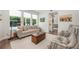 Cozy living room featuring comfortable seating, lots of natural light, and easy access to the outdoor pool area at 10241 Pointview Ct, Orlando, FL 32836