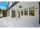 Expansive covered patio with a ceiling fan and multiple windows overlooking the backyard and pool at 10241 Pointview Ct, Orlando, FL 32836
