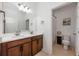Bathroom features a double sink vanity with modern fixtures and a separate toilet room at 1027 Eagle Tree Ln, Sanford, FL 32771