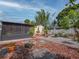 Landscaped backyard features brick and gravel patios, lush trees, and a screened-in porch at 1041 N Fern Creek Ave, Orlando, FL 32803