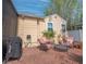 Charming backyard features brick patio, seating, exterior home views, lush plants, and a privacy fence at 1041 N Fern Creek Ave, Orlando, FL 32803