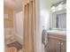Cozy bathroom featuring a shower with curtain, gray vanity, and tiled floors at 1041 N Fern Creek Ave, Orlando, FL 32803