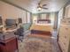 Large bedroom with hardwood floors, ceiling fan and sound dampening panels at 1041 N Fern Creek Ave, Orlando, FL 32803
