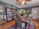 Inviting dining room featuring a wooden table, area rug, and decorative furnishings at 1041 N Fern Creek Ave, Orlando, FL 32803