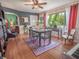 Warm dining room with a large window, hardwood floors, and adjoining living spaces at 1041 N Fern Creek Ave, Orlando, FL 32803