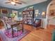 Inviting dining room with hardwood floors, area rug, and built-in bookshelves at 1041 N Fern Creek Ave, Orlando, FL 32803