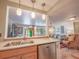 Open kitchen view showcases a dishwasher and a seamless flow to living spaces at 1041 N Fern Creek Ave, Orlando, FL 32803