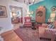 Cozy living room features unique decor, bright accent wall and warm natural lighting at 1041 N Fern Creek Ave, Orlando, FL 32803