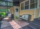 Inviting porch features comfortable seating, a decorative rug, and access to the exterior of the home at 1041 N Fern Creek Ave, Orlando, FL 32803