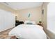 Neutral bedroom with a large closet, desk, and comfortable bed at 1046 Morris Ave # 1046, Orlando, FL 32803