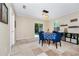 Cozy dining area with a modern light fixture, backyard access, and convenient access to the kitchen at 1046 Morris Ave # 1046, Orlando, FL 32803