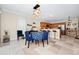 Open concept dining area connecting to kitchen and with modern light fixture at 1046 Morris Ave # 1046, Orlando, FL 32803