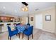 Dining area with an open layout, travertine floors, and a modern chandelier at 1046 Morris Ave # 1046, Orlando, FL 32803