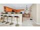 Kitchen with granite countertops, a breakfast bar, stainless steel appliances, and travertine floors at 1046 Morris Ave # 1046, Orlando, FL 32803