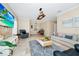 Warm and inviting living room featuring tile floors, comfortable seating, and plenty of natural light at 1046 Morris Ave # 1046, Orlando, FL 32803