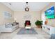 Cozy living room featuring neutral tones, a stylish rug, and ample seating for entertaining at 1046 Morris Ave # 1046, Orlando, FL 32803