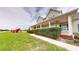 A spacious yard with a playset and covered porch showcases the property's outdoor living space at 10809 Arrowtree Blvd, Clermont, FL 34715
