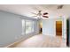 Spacious bedroom with ample natural light, ceiling fan, and an ensuite bathroom at 10809 Arrowtree Blvd, Clermont, FL 34715