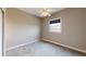 Cozy bedroom features a window with a blue shade, carpet, and neutral paint at 10809 Arrowtree Blvd, Clermont, FL 34715