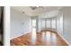 Spacious bedroom featuring hardwood floors, tray ceiling, and a private balcony entrance at 10809 Arrowtree Blvd, Clermont, FL 34715