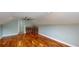 Large bonus room featuring hardwood floors, a ceiling fan, and a built-in wet bar at 10809 Arrowtree Blvd, Clermont, FL 34715