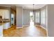 Cozy dining area with tile flooring leading to a patio with an outdoor pool view at 10809 Arrowtree Blvd, Clermont, FL 34715