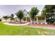 Charming home featuring a welcoming front porch, green shutters, and a well-manicured lawn at 10809 Arrowtree Blvd, Clermont, FL 34715