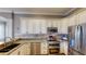 Well-equipped kitchen with granite countertops and stainless steel appliances at 10809 Arrowtree Blvd, Clermont, FL 34715