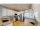 Modern kitchen featuring granite countertops, stainless steel appliances, and custom cabinets at 10809 Arrowtree Blvd, Clermont, FL 34715