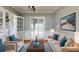 Comfortable living room with plush seating, stylish decor, and natural light at 10809 Arrowtree Blvd, Clermont, FL 34715