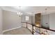 Bright and open loft area with white railing overlooking the lower level at 10809 Arrowtree Blvd, Clermont, FL 34715