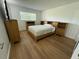 Bright bedroom featuring wood floors, closet, furnishings and lots of natural light at 118 S Halifax Ave # 409, Daytona Beach, FL 32118
