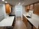 Updated kitchen featuring sleek countertops, modern stainless-steel appliances, and updated cabinets at 118 S Halifax Ave # 409, Daytona Beach, FL 32118