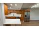 Updated kitchen features stainless steel appliances, quartz countertops, and breakfast bar seating at 118 S Halifax Ave # 409, Daytona Beach, FL 32118