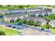 A view of multi-Gathering apartment buildings, parking spaces, and green spaces at 130 Claire Ln, Davenport, FL 33837