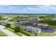 An aerial view of apartment buildings with parking and landscaped areas at 130 Claire Ln, Davenport, FL 33837