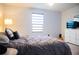 Bedroom with comfortable bed, window and closet space at 130 Claire Ln, Davenport, FL 33837