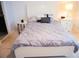Bedroom with comfortable bed with end tables, lamp and closet space at 130 Claire Ln, Davenport, FL 33837