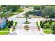 Elegant gated community entrance with lush landscaping, stone pillars, and secure access at 130 Claire Ln, Davenport, FL 33837