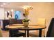 Dining room with a dark wood table and four chairs, plus a decorative centerpiece at 130 Claire Ln, Davenport, FL 33837