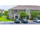 Inviting two-story townhome with neutral siding, landscaped grounds, and convenient parking at 130 Claire Ln, Davenport, FL 33837