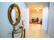 A hallway with a glass table and views into the living area at 130 Claire Ln, Davenport, FL 33837