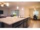 Island kitchen featuring granite countertops and stainless steel appliances at 130 Claire Ln, Davenport, FL 33837