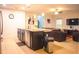 Spacious kitchen features a large island with a granite countertop and seating at 130 Claire Ln, Davenport, FL 33837