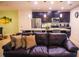 Inviting living room with modern kitchen and a nice sofa at 130 Claire Ln, Davenport, FL 33837