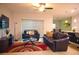 A living room with leather couches and a view of the breakfast bar and kitchen at 130 Claire Ln, Davenport, FL 33837