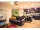 The living room offers an open plan view to the modern kitchen and stainless appliances at 130 Claire Ln, Davenport, FL 33837